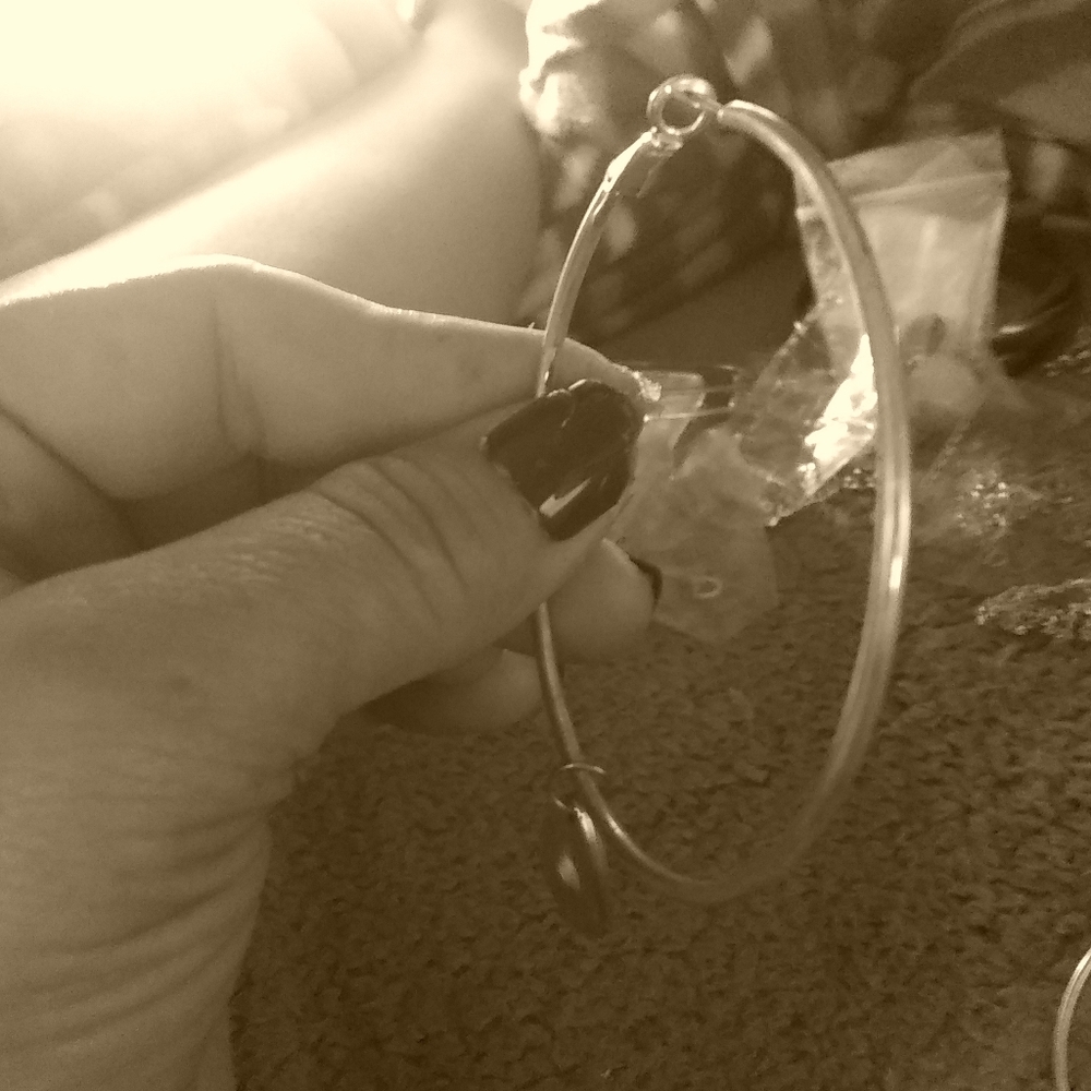 Large sterling silver hoop earrings with pendants